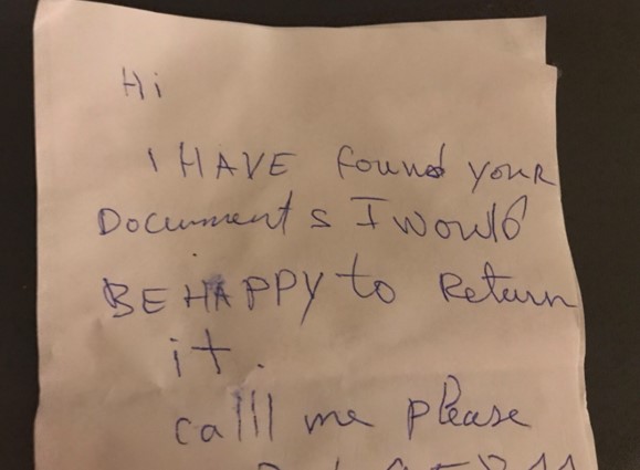 a hand-written note from the man who found the lost wallet which reads ‘I have found your documents. I would be happy to return it. Call me please.’