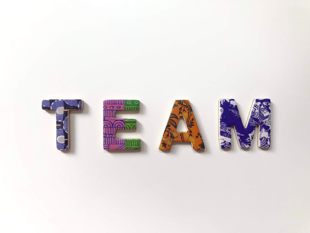 The word team in bright colours on a white background