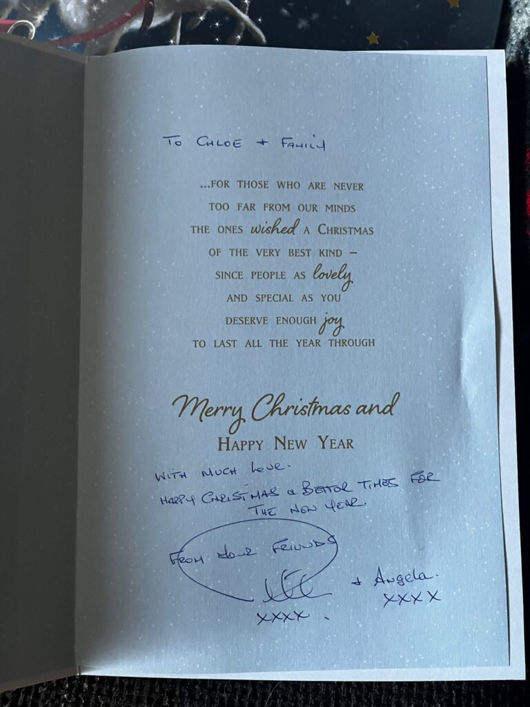 a card which reads "to Chloe and family, with much love. Happy Christmas and better things for the new year, from your friends."