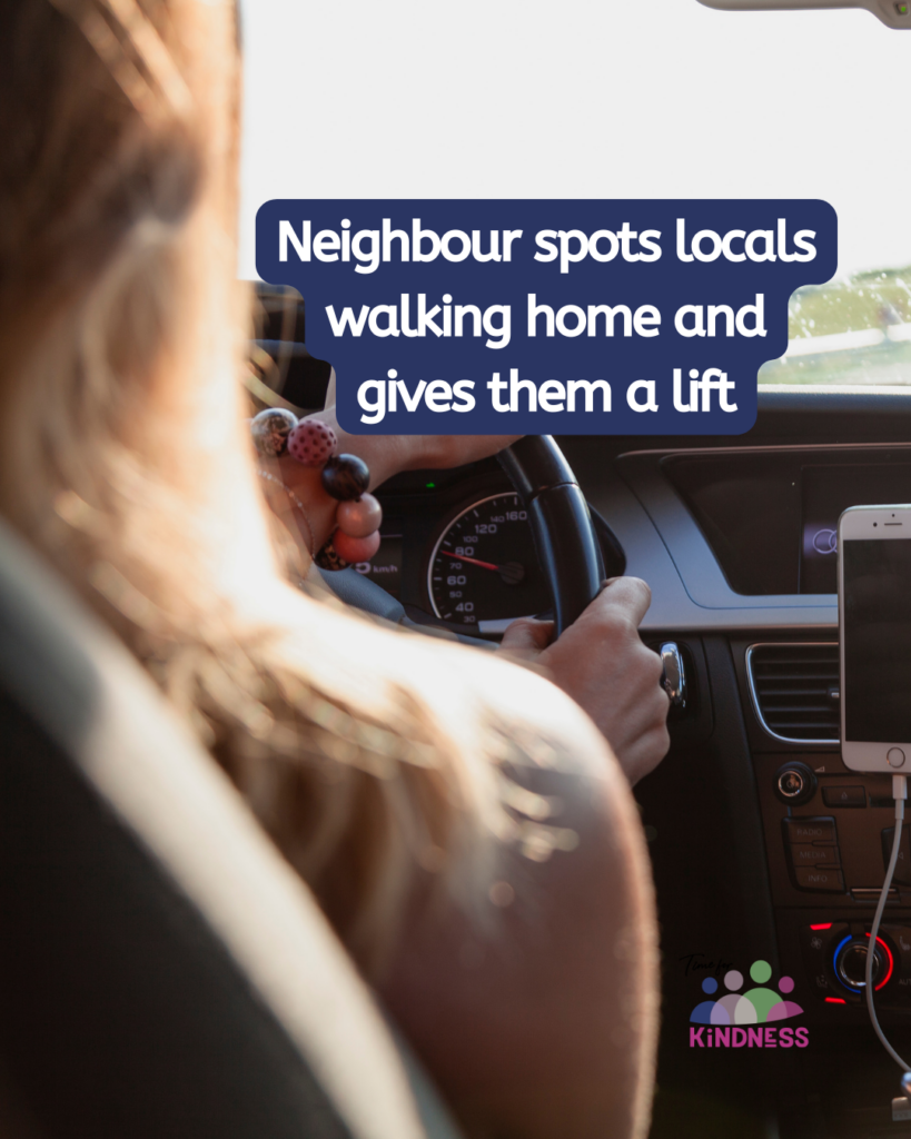 view from the back seat of a car of a woman with long hair wearing a large beaded bracelet driving the car. To the side of her text reads "Neighbour spots locals walking home and gives them a lift."