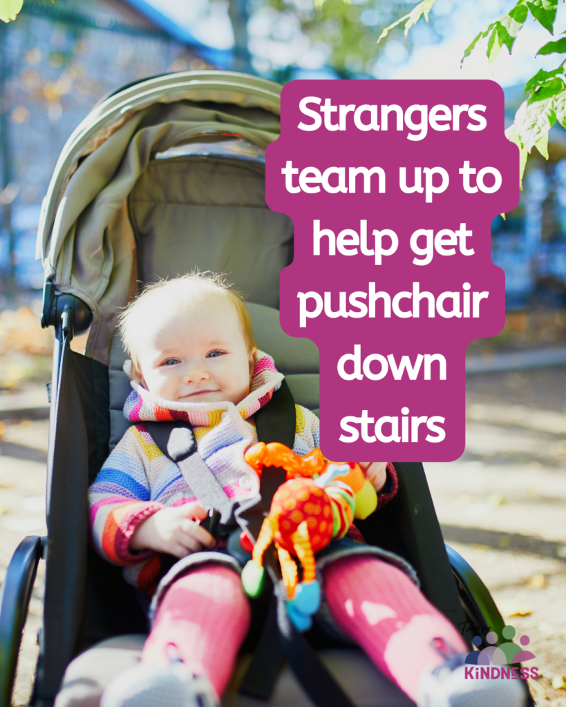 a toddler in a pushchair holding a small toy and smiling at the camera. Text overlaid reads "Strangers team up to help get pushchair down stairs.”