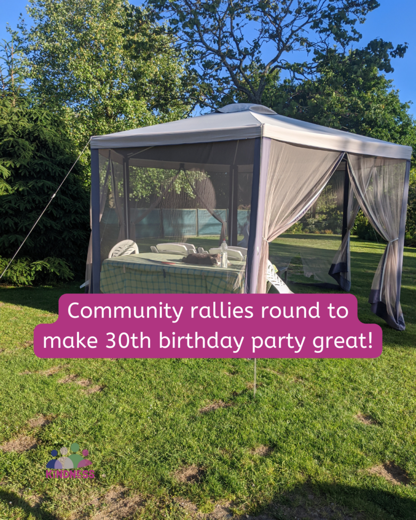 A gazebo with net sides and a table inside with chairs around it, on a green space with trees behind it. Text overlaid reads “Community rallies round to make 30th birthday party great!”