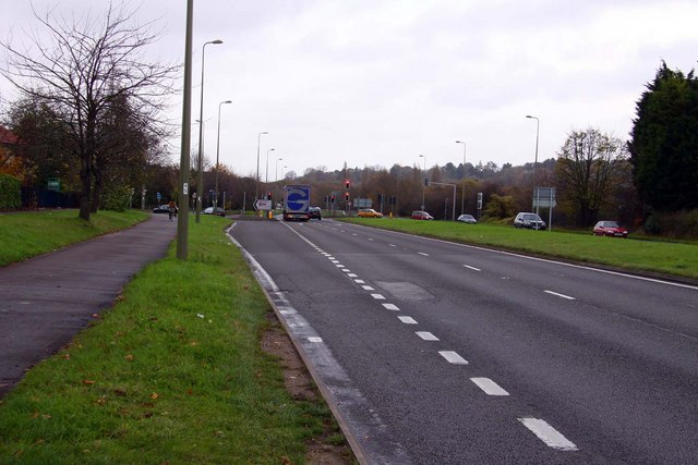 a two lane road with footpath on the side.