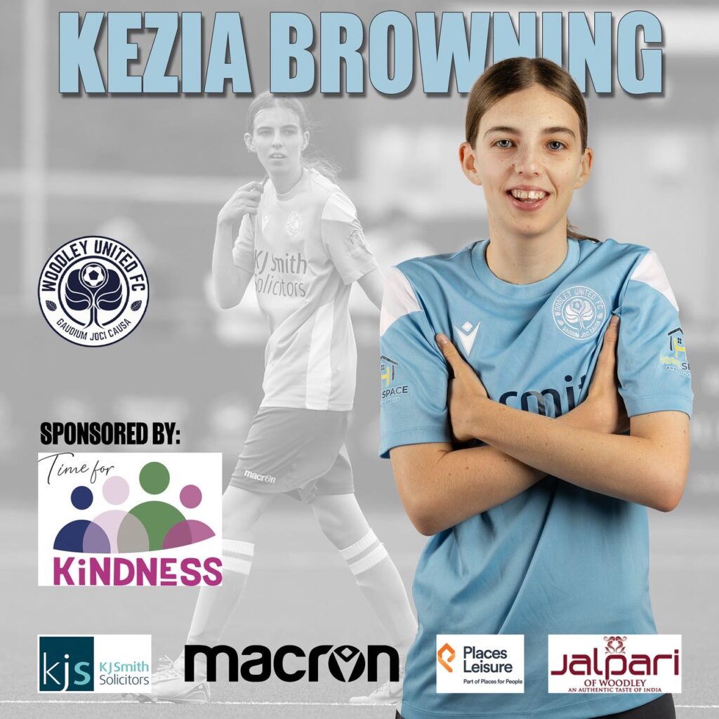 a young woman with light skin tone and long brown hair tied back, wearing a pale blue Woodley United shirt, her arms crossed in front of her. Behind her is a black and white photo of her on the pitch playing football. Above text reads “Kezia Browning” with logos for Woodley FC, Time for Kindness, KJ Smith solicitors, Macron, Places Leisure, and Jalpari