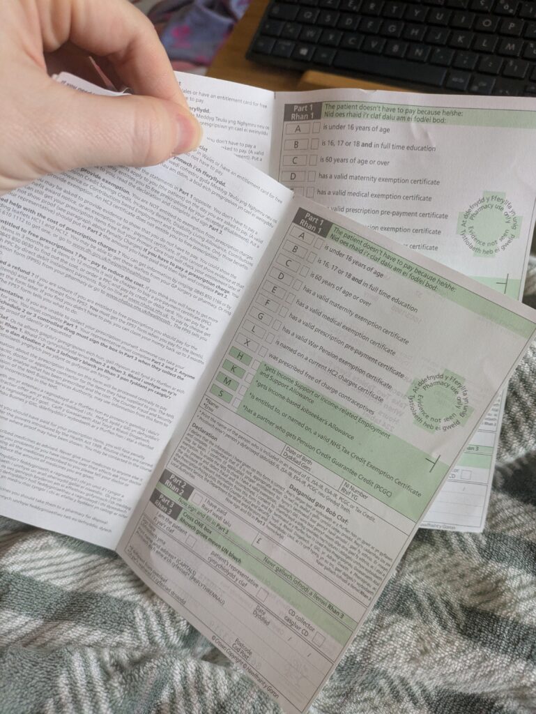 the back of two UK NHS prescriptions stapled together.